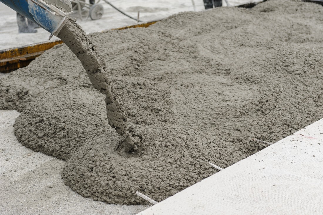 pouring concrete into a mold